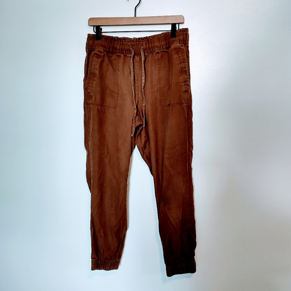 Loft brown drawstring high rise jogger pants with some red stains and flaws show